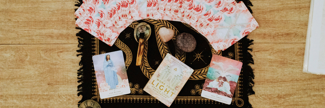 tarot cards and oracle cards on a beautiful altar cloth, getting ready for a spiritual practice to release stress let go of anxiety and become more at peace